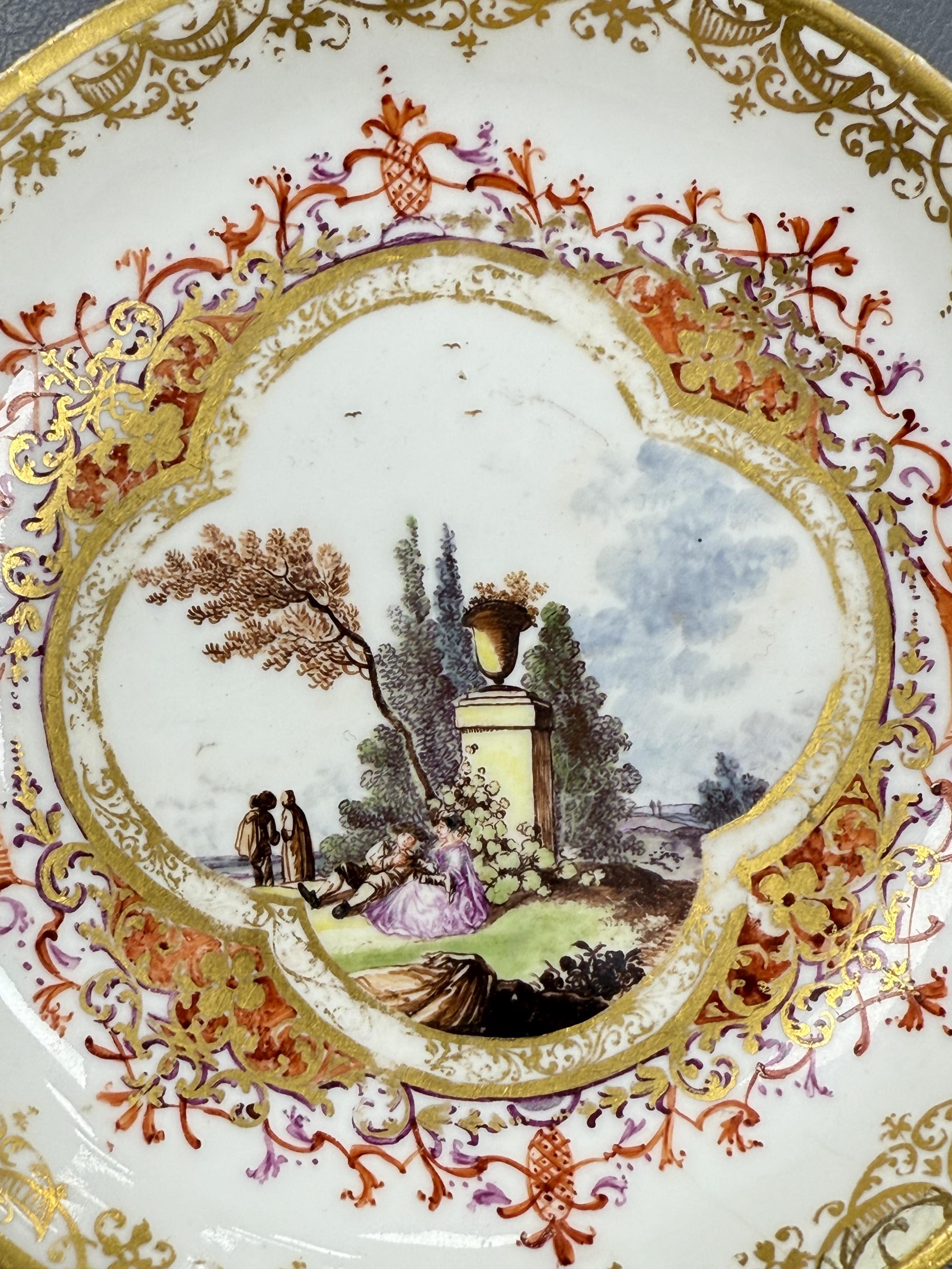 A Meissen cup and saucer, similar tea bowl and two saucers, c.1735-45